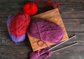 Knitting yarn with needles on wooden table Royalty Free Stock Photo