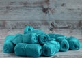 Blue yarns for knitting handmade clothes lies on a light background. Royalty Free Stock Photo