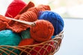 Knitwork tools and thread balls in a basket Royalty Free Stock Photo