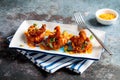 knock out fried shrimp with sauce served in a dish isolated on napkin side view of fastfood Royalty Free Stock Photo