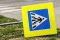 Knocked down european pedestrian crossing sign