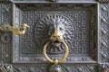 knocker Koln Cathedral, an imposing lion is the one who holds the ring