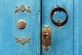 Knocker And Lock On Old Blue Wooden Door