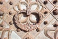 Knocker of an old forged ornate door