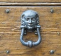 Knocker on an old wooden door.