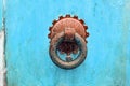 Knocker ring on an old blue painted door Royalty Free Stock Photo