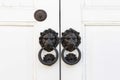 Knockers and handles on ancient doors, Old metal door handle on a wooden door