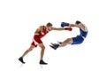 Knockout punch. Two male professional boxers boxing  on white studio background. Concept of sport, competition Royalty Free Stock Photo