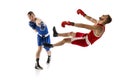 Knockout punch. Two male professional boxers boxing  on white studio background. Concept of sport, competition Royalty Free Stock Photo