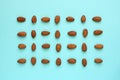 Knolling flat lay almonds on blue Royalty Free Stock Photo