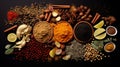 Knolling picture showing Indian spices. Laid out on a dark slate counter