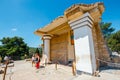 Unknown people visit ancient ruins of famous Minoan palace of Knossos, Crete Island, greece Royalty Free Stock Photo