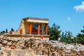 Unknown people visit ancient ruins of famous Minoan palace of Knossos, Crete Island, greece