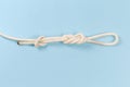 Knot ÃÂ°igure-eight loop with stopper knot on blue background