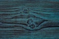 Knots of wood. Background, the texture of beautiful wood, artificially aged, painted blue