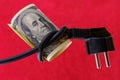 Knotted electric cord around the neck of the president of the dollar bill, selective focus. Concept of the energy crisis