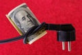 Knotted electric cord around the neck of the president of the dollar bill, selective focus. Concept of the energy crisis