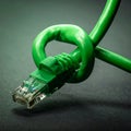 Knotted Ethernet Cable Symbolizing Network Problems (1 Royalty Free Stock Photo