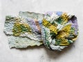 Knotted patchwork scarf sewn from silk fabrics