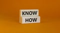 Know how symbol. Concept words `know how` on wooden blocks on a beautiful orange background. Business and know how concept, copy