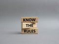 Know the rules symbol. Wooden blocks with words Know the rules. Beautiful grey background. Business and Know the rules concept. Royalty Free Stock Photo