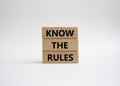 Know the rules symbol. Wooden blocks with words Know the rules. Beautiful white background. Business and Know the rules concept. Royalty Free Stock Photo