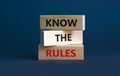 Know the rules symbol. Wooden blocks with words `know the rules` on beautiful grey background. Business, know the rules concept.
