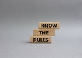 Know the rules symbol. Wooden blocks with words Know the rules. Beautiful grey background. Business and Know the rules concept. Royalty Free Stock Photo