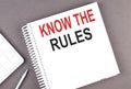 KNOW THE RULES text on the notebook with calculator and pen Royalty Free Stock Photo