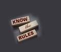 Know the rules word on wooden blocks isolated on dark grey background. business process regulation concept Royalty Free Stock Photo