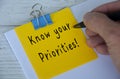 Know your priorities text written on yellow notepad. Priority concept Royalty Free Stock Photo