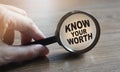 Know Your Worth under Magnifying glass. Self motivation coaching HR concept. Royalty Free Stock Photo