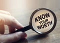 Know Your Worth under Magnifying glass. Self motivation coaching HR concept Royalty Free Stock Photo