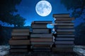 Knowledge concept. Stack of books on a night Royalty Free Stock Photo