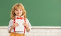 knowledge day. concept of education. nerd kid with long hair at blackboard. september 1. Royalty Free Stock Photo