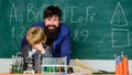 Knowledge day. My father is scientist. Teacher bearded man father and child test tubes. Study chemistry together. Boys