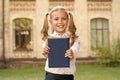 Knowledge day. Ready for lessons. Secondary school student. Cute smiling small child hold book. Adorable little girl Royalty Free Stock Photo