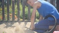 Using a pump, a curious child modeled a volcano eruption in a sandbox