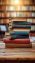 Knowledge hub Stacks of books, wooden table, blurred bookshelf environment