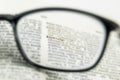 Knowledge word close up, view through nearsighted lens glasses Royalty Free Stock Photo