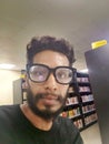 Knowledgeable man reading in library environment Royalty Free Stock Photo