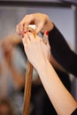 She knows what shes doing. a female hairdresser cutting a clients hair.