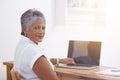 She knows what shes doing. Portrait of a mature businesswoman working on her laptop at her desk.