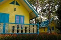 KO CHANG, THAILAND - APRIL 8, 2018: Typical resort houses for tourists - Vivid yellow and blue camping place buildings