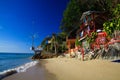 KO CHANG, THAILAND - DECEMBER 7. 2018: View on white sand beach with green trees and colorful wood houses
