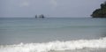 Fishing boat sail near the beach of the paradise coconut island