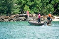 Ko Lanta, Krabi, Thailand:October 22, 2019 - Fishermen drive the traditional long-tail boat and find fish by tools in sunny day