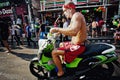 KO SAMUI, THAILAND - APRIL 13: Unidentified dirty wet biker in a water fight festival or Songkran Festival