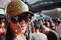 KO SAMUI, THAILAND - APRIL 13: Unidentified girl in a baseball cap under water jets in a water fight festival or Songkran Festival