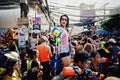 KO SAMUI, THAILAND - APRIL 13: Unidentified girl shooting water at the camera on Songkran Festival